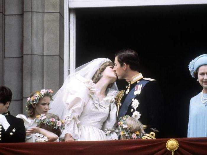 1981: The queen looks over the crowd of 600,000 people who lined the streets of London on the day of Charles and Diana