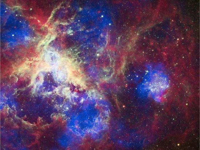 This incredibly colorful image is of the Tarantula Nebula — so named because its glowing filaments resemble spider legs — celebrated Hubble