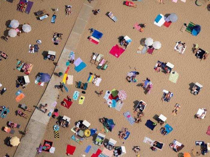 And these sunbathers are taking the opportunity to soak in some rays at a sweltering beach in Berlin.