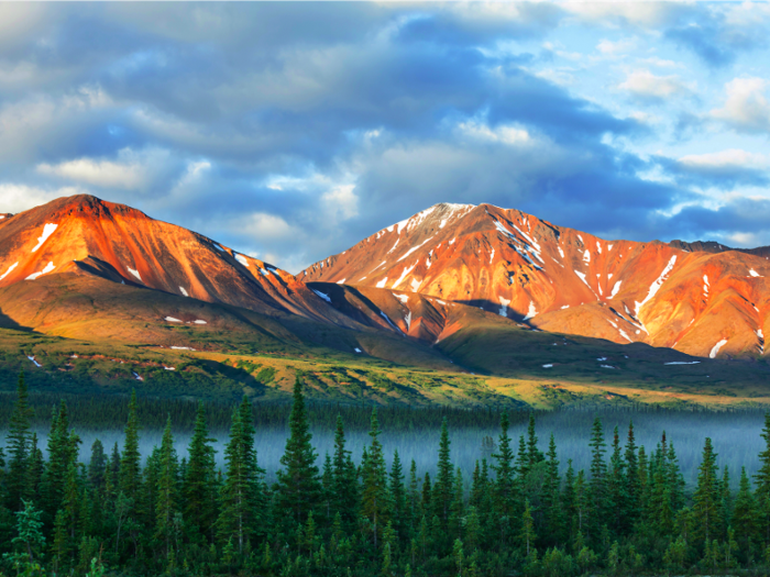 Denali National Park and Preserve is home to 6 million acres of Alaskan wilderness, where travelers will spot wildlife roaming freely and take in a beautiful landscape that includes Denali, the highest mountain peak in North America at 20,310 feet. Climate change has led to glacier melt and reduced snowfall, which is affecting its wildlife.