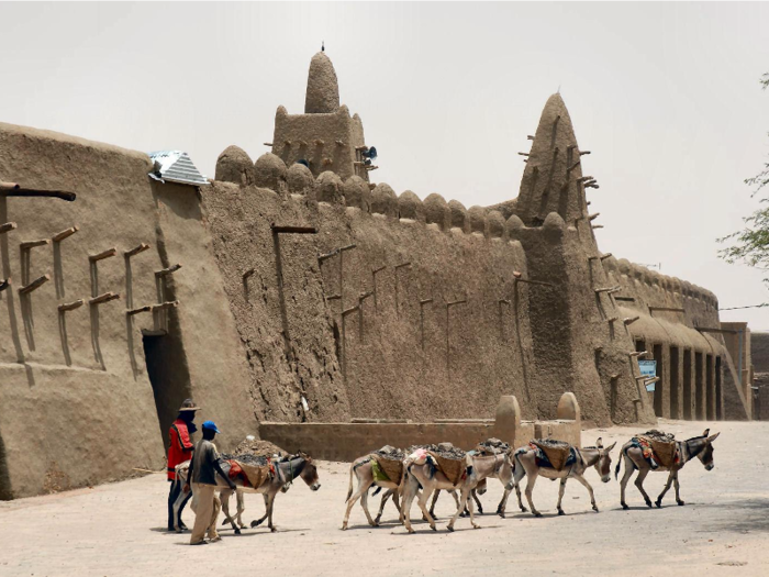 The walls of the mosques in Timbuktu, Mali, were built mainly out of mud between the 14th and 16th centuries. Increases in temperature and rainfall over the years have been causing a continued threat to their stability.