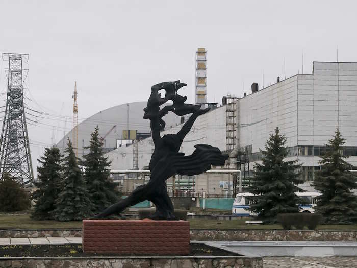 A monument stands at the entrance to the power plant, commemorating the workers who lost their lives in the disaster. Chernobyl is haunted "by both a hushed desolation and clangorous activity, the sense of a ruined past and a difficult future," according to a description from The Associated Press.