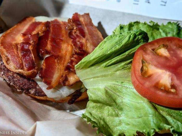 The ingredients are typically of shockingly good quality. The tomatoes are crisp and red; the lettuce, vibrant and fresh – far cries from the anemic and pale toppings of fast food yesteryear. Even the bacon has a crispiness and sheen to it that suggests a certain level of respectability.