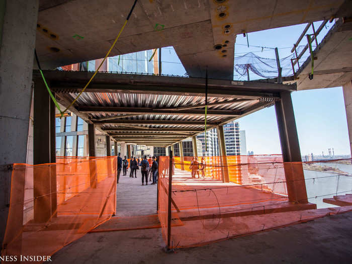 The three-story skybridge is still very much under construction. It will house the two-story fitness center, a lounge, a lap pool, and also much of the towers