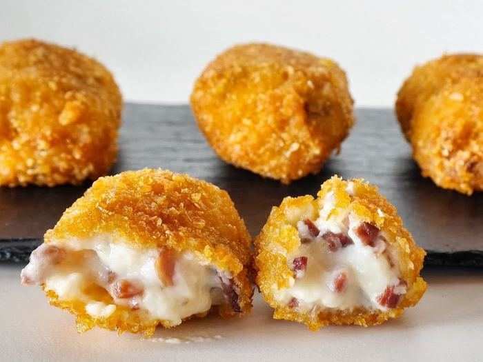 Croquetas de Jamón are popular across Spain. These fried balls of Serrano ham, eggs, cheese and just about any vegetable are often served as a snack at tapas.