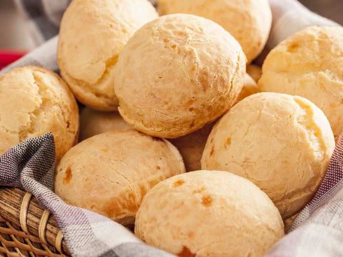 Pão de queijo is a baked cheese roll commonly eaten as a snack or breakfast food in Brazil. These cheese puffs are crispy on the outside and chewy and hot on the inside. Pretty simple, very tasty.