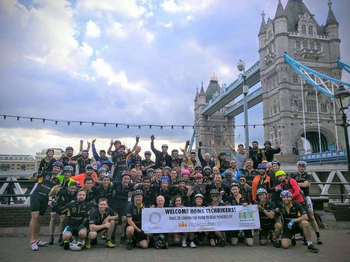 The riders gather for photo opportunities at famous landmarks on the route, including Tower Bridge in Central London.