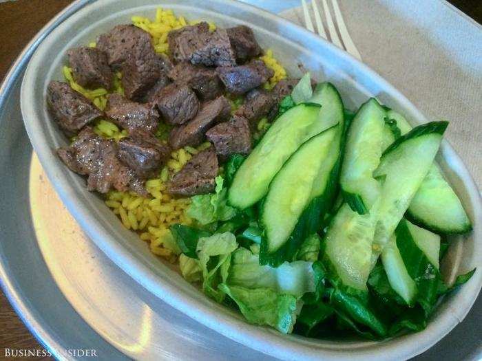 First up: a bowl of savory beef on a bed of turmeric rice, with lettuce and cucumbers — a simple choice to test the flavors of the basics. The portion is big, especially considering the price: $10.75 for the beef bowl, and $9.75 for a beef wrap.