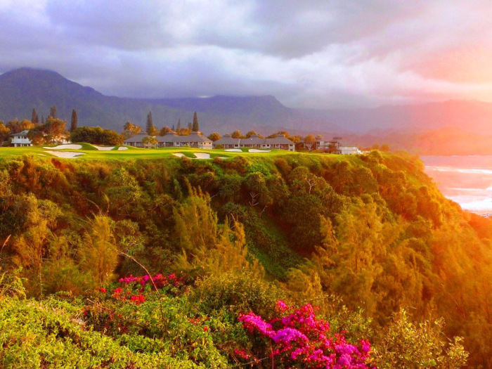 The Princeville Makai Golf Course in Princeville, Hawaii, was designed by Robert Trent Jones, Jr. and includes stunning views over Hanalei Bay at its signature 7th hole. The course is also one of the first to offer players GolfBoards — vehicles that are designed to make players feel as though they are surfing through the terrain.