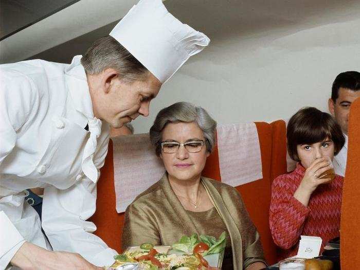 Back in 1969, some passengers were served meals directly by an in-flight chef. Here, the chef is dishing up Smørrebrød, a type of Danish open sandwich (rye bread topped with meat or fish and cheese).
