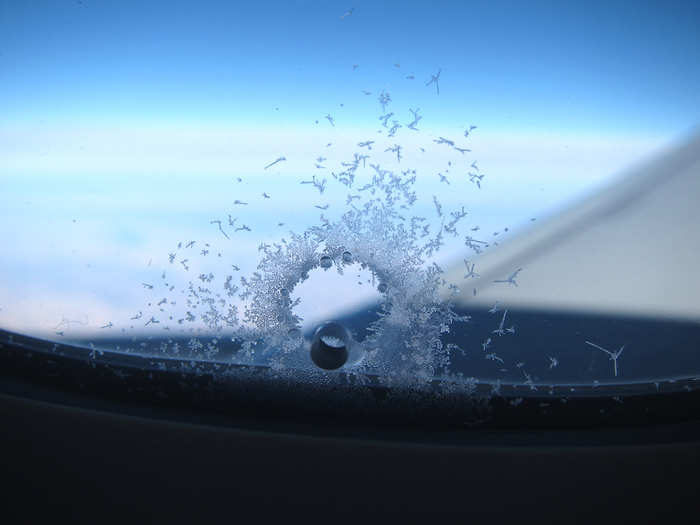 A cockpit window fell out of its frame