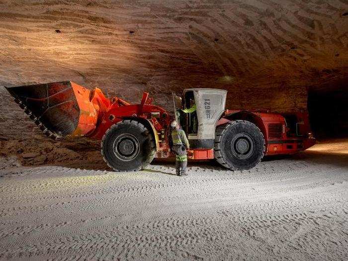 The first operation for mining rock salt is undercutting, a process by which large machines cut a space 10 or more feet deep into a solid salt wall.