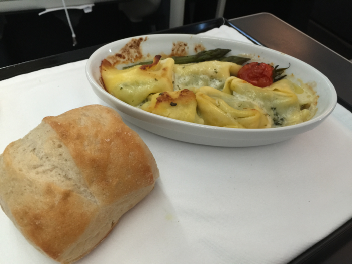 About an hour later, we were served dinner. Passengers had a choice of chicken in a red wine sauce, or spinach and cheese tortellini served with warm bread. I went with the pasta. It was simple, yet flavorful. And the portion sizes were perfect.