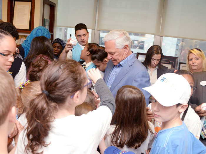 Former baseball star Bobby Valentine signs autographs.