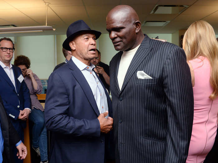 Reggie Jackson speaks with Lawrence Taylor.