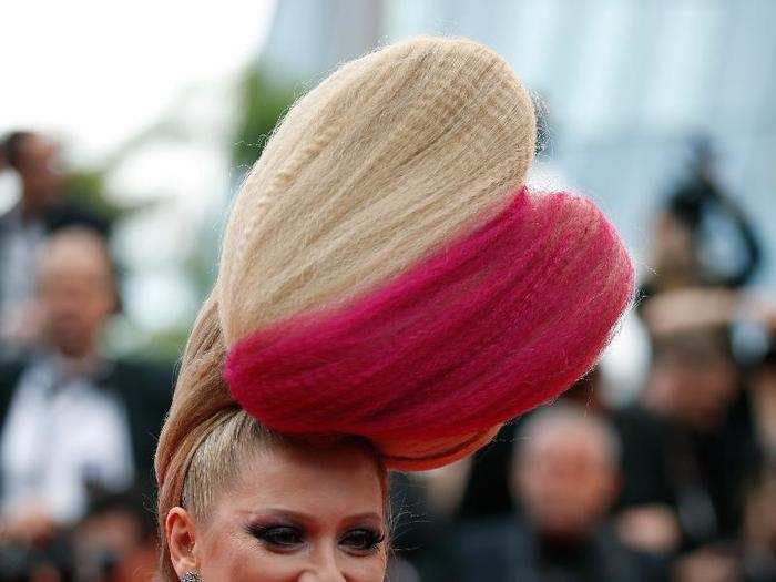 Russian TV star Elena Lenina continues her tradition of arriving on the red carpet with an insane hairstyle.