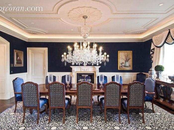 The dining room comes complete with a massive chandelier.