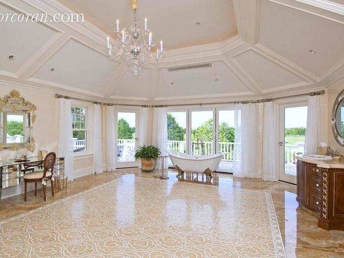 The master bathroom looks more like a ballroom than a place to bathe.