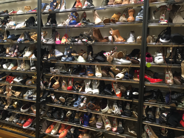 This is one of multiple clearance rooms filled with unwanted shoes. No one wants them.