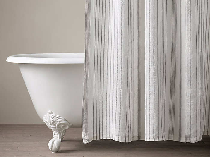 Man cannot live with a shower liner alone — you need a curtain. This subtle yet classy Restoration Hardware curtain sends the right message.