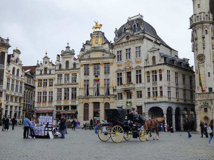 BELGIUM: Visitors congregate in the centre of Brussels at La Grand-Place, a charming market square flanked by historic buildings that date back to the late 17th century, including the King