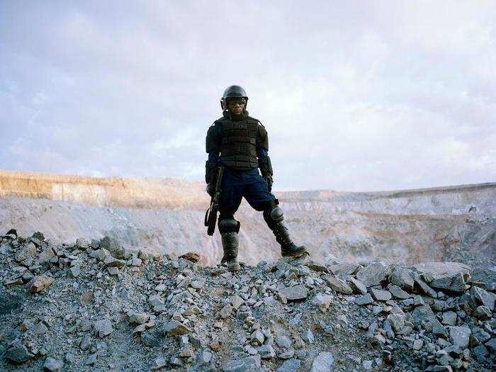 "This photograph comes from a diamond mine in Tanzania. Within this series [photographer David] Chancellor also documents impoverished locals who happen to live close to the mine, and who are scrambling all over the rocks to try to get traces of diamond dust or rock," Little said. "I just love this perfect distillation into one frame of high luxury, the environmental costs of mining, and the high-powered violence that can be brought to bear when privilege is questioned.”