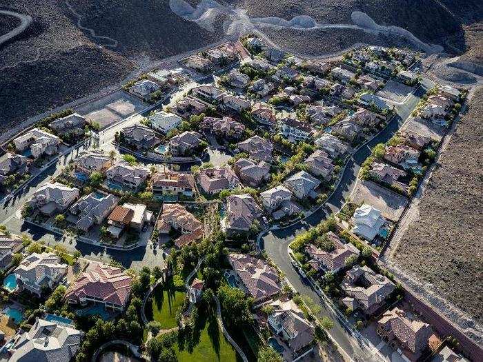 This image, an aerial view of a gated community in Henderson, Nevada, brought the question of sustainability to Little