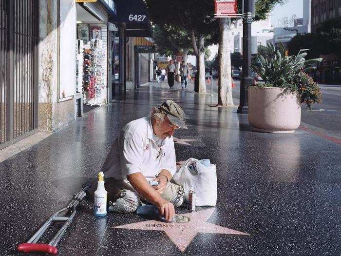 The powerless celebrating the powerful is something I see in America quit a lot," Little said. "I want to avoid criticizing the man in the photograph; instead what appeals to me is the metaphor, the larger idea around this.