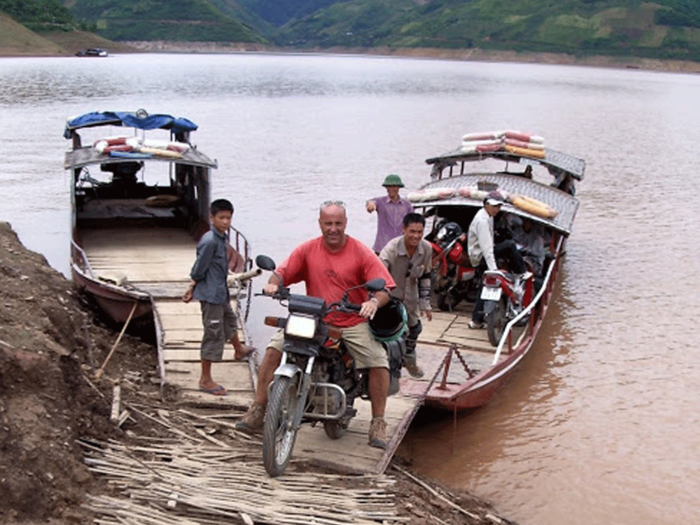 We came across a river that proved difficult to navigate, so we loaded our bikes onto a boat and ferried across.