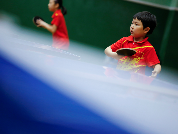 The Shanghai Sports School says it wants to use sports training to educate children. Many other schools are adopting this philosophy.