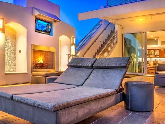 Take in those views from this beautiful deck, which comes equipped with a TV and fireplace.