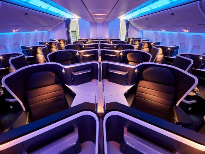 The business class cabin has 37 seats — excuse us, "private suites" — that are set up in a herringbone pattern.