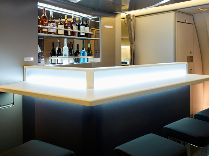 It gets even better: business class has a full bar and lounge to stretch out in. The bar serves snacks, beer, wine, spirits, cocktails, hot drinks, hors d