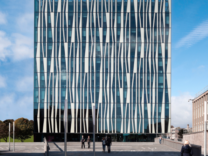 The zebra-like stripes on the University of Aberdeen New Library are insulated panels, cutting energy costs. They also glow at night, lighting the way for students.