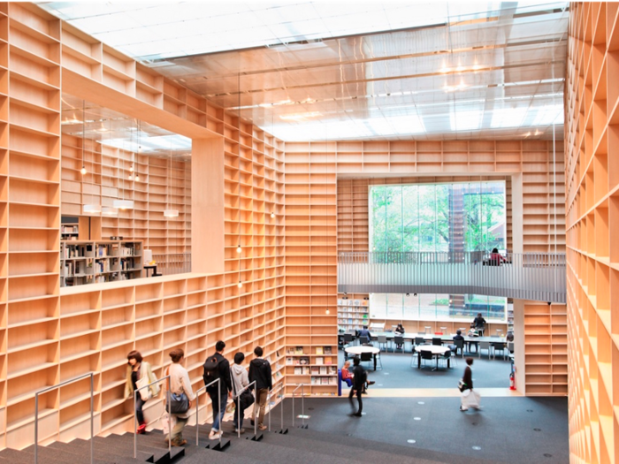 Bookshelves surround visitors at the Musashino Art University Museum & Library in Tokyo. It looks like a spiral from above, drawing book-lovers inward.