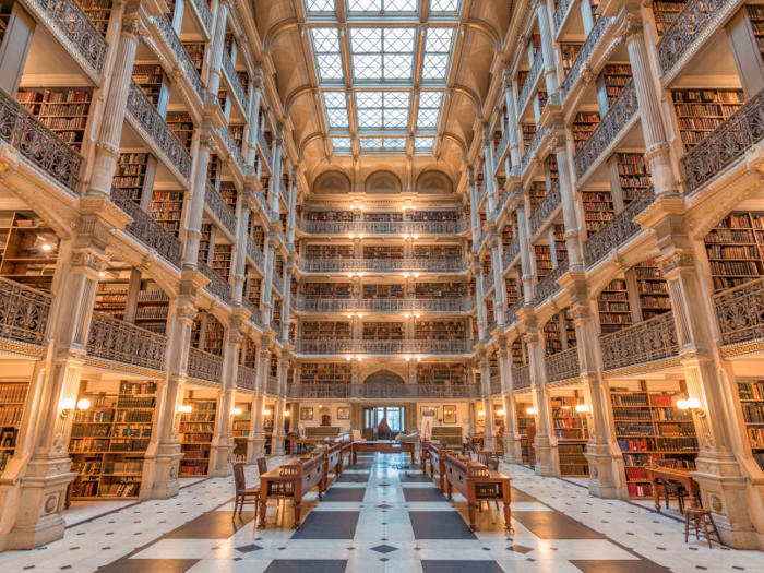 Five tier, cast-iron balconies form the centerpiece of the George Peabody Library at Johns Hopkins University. It contains over 30,000 titles dating back to the 1700s.