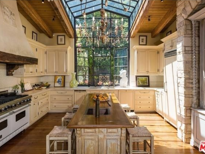 The rustic kitchen has a beautiful skylight, which lets in tons of light.