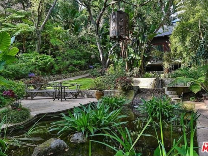 The house has super lush gardens — it looks like it