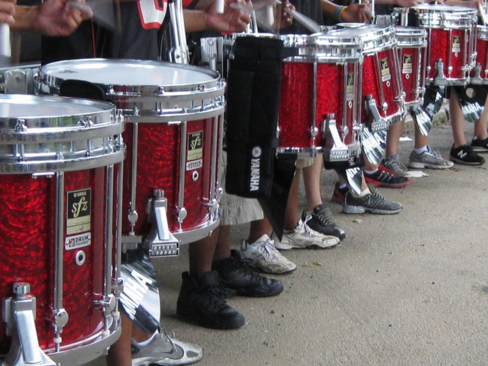 A test-taker sat by another guy with a penchant for drumming.