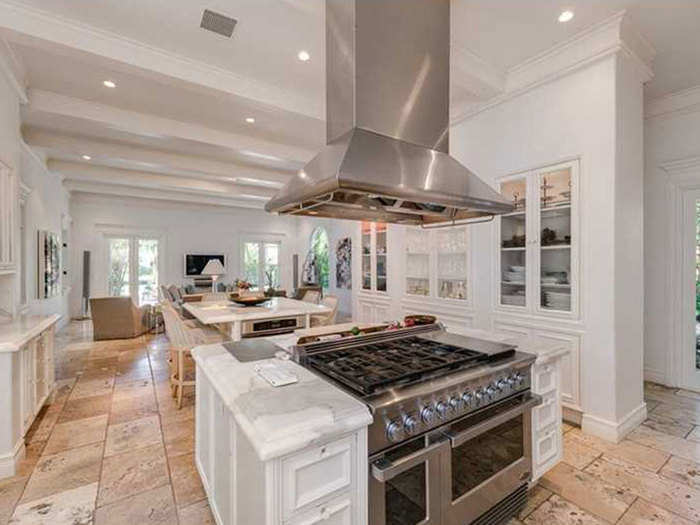 The kitchen is bright and includes a sitting area and dining space.