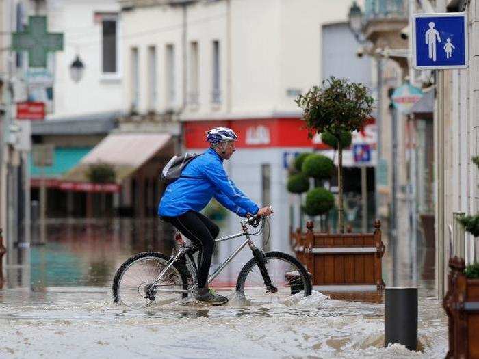 However, one brave soul faced the flooding on bike.