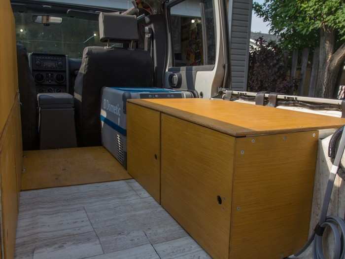 I lined the cabinets with plywood — light and durable. I was too tired to take progress shots.