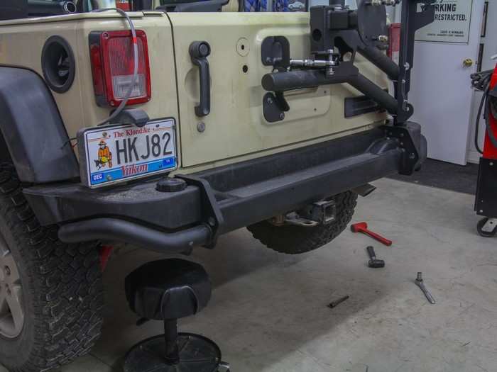 We installed a heavy-duty rear bumper and swing-away carrier to hold the extra weight of the stuff I