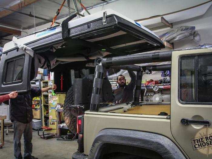 I had a pop-up roof installed by a company called Ursa Minor. This replaces the stock Jeep hard top, and pops open. Normally it