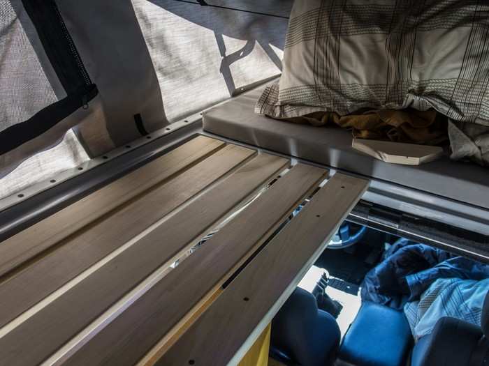 This is during the building of the sleeping slats. They fold and slide out of the way on each side when I want standing room, or make a flat surface that the mattress section sits on when I want the upstairs sleeping platform.