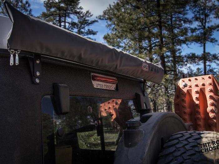 We mounted an ARB awning on the back of the Jeep for a rain/sun shade. You can see it open in the first pic.