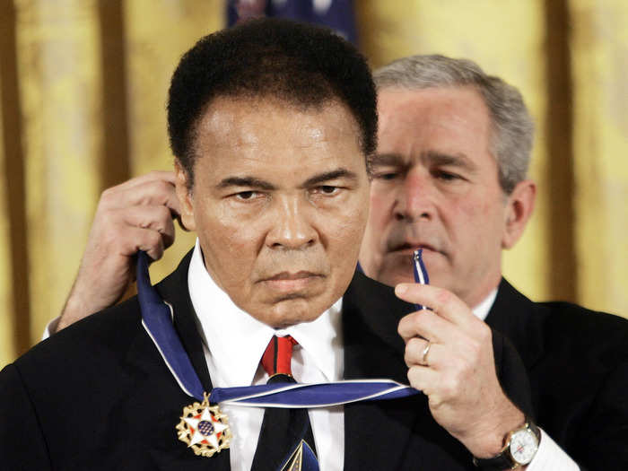 President George W. Bush presents the Presidential Medal of Freedom to Ali, Wednesday, Nov. 9, 2005.