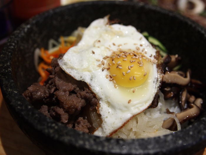 Bibimbap is rice mixed with fresh vegetables and chili pepper paste.