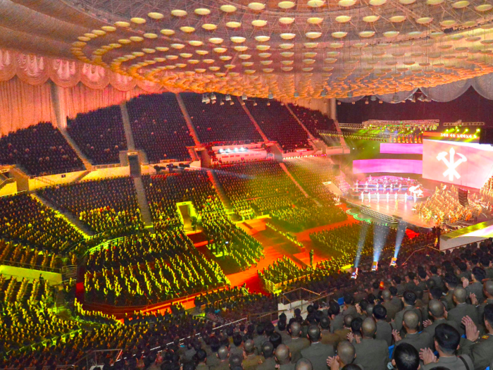 Back home in North Korea, The Moranbong band perform to vast audiences in huge stadiums.