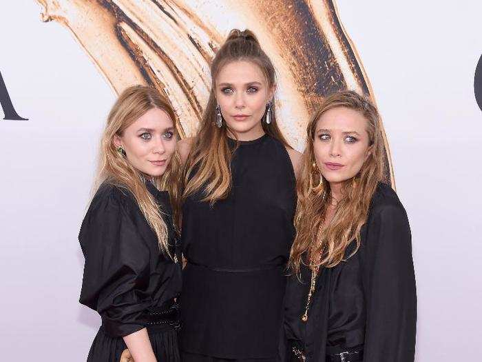 The Olsen twins arrived with their younger sister, actress Elizabeth Olsen.